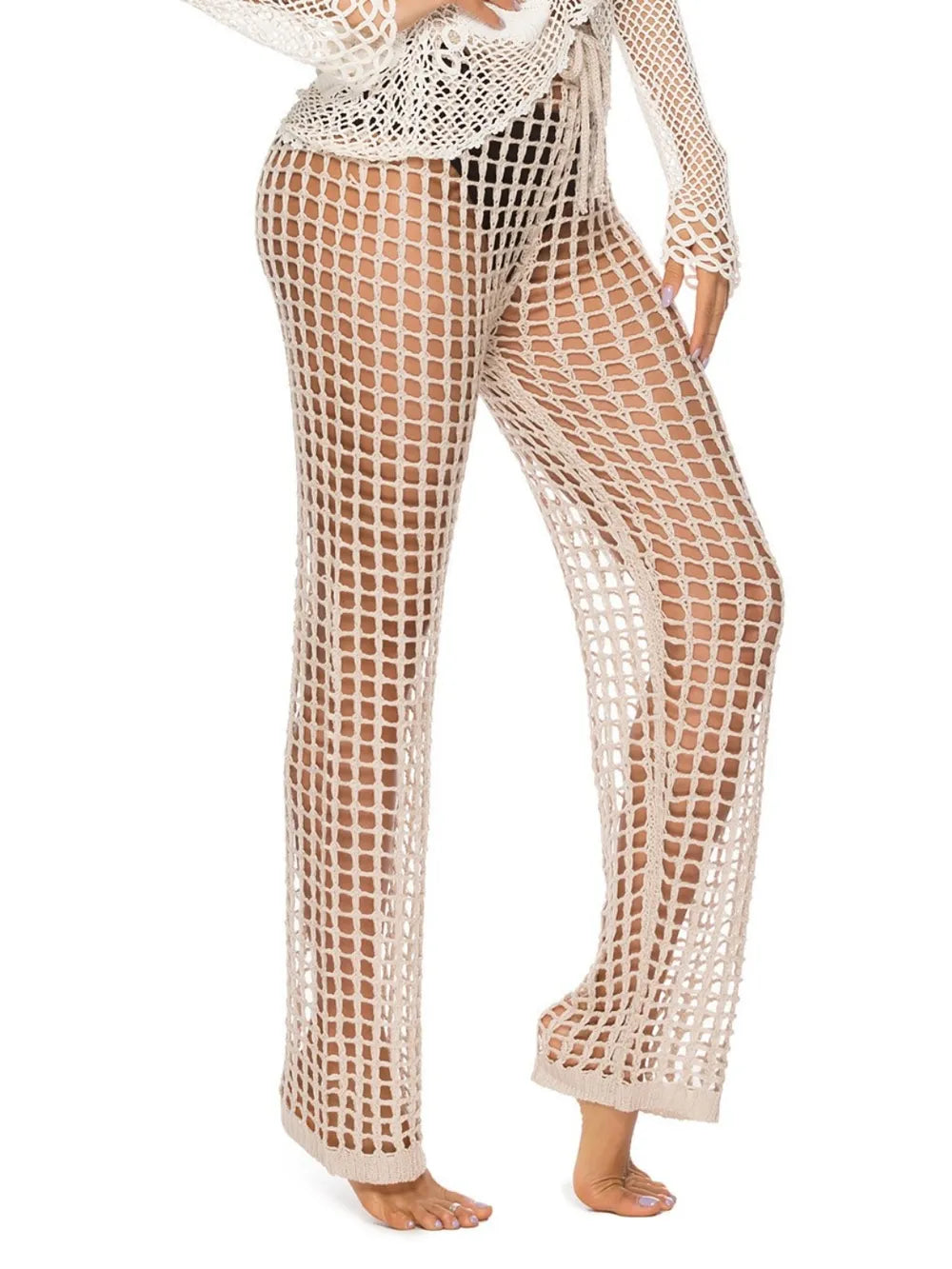 High‑waist cutout swim cover‑up pants with tie‑up closure in a solid color, displayed on a plain background.