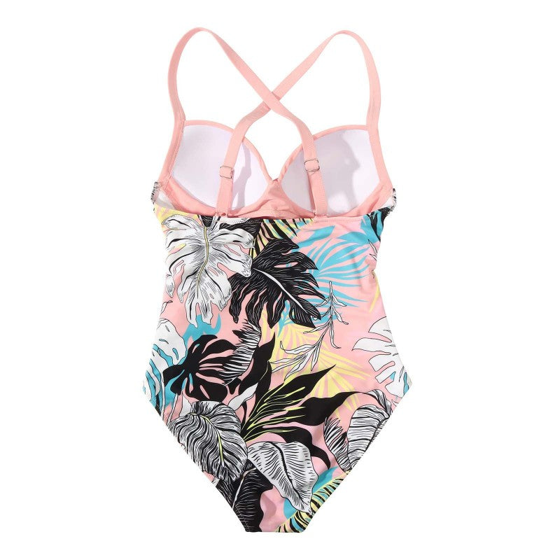 One-piece swimsuit with tropical leaf pattern and pink straps on a white background