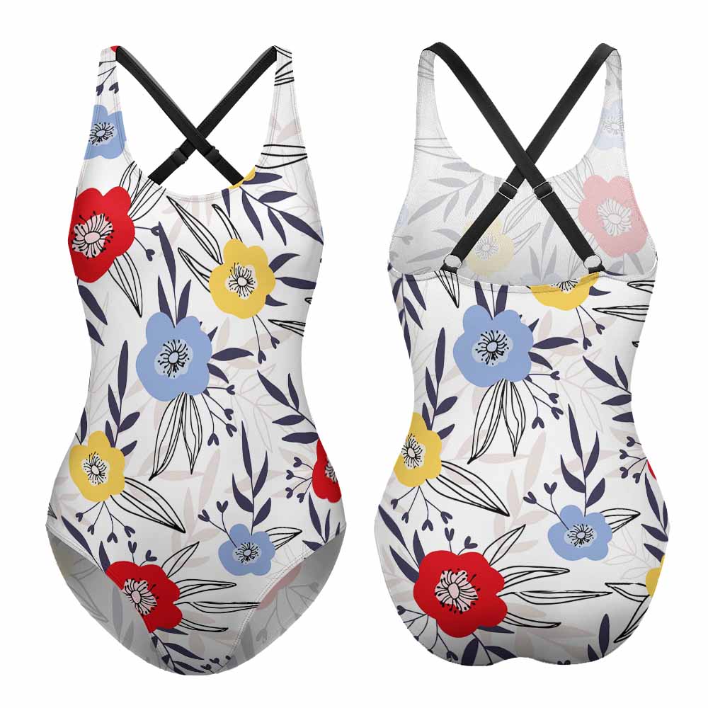 A floral swimsuit against a white background. 