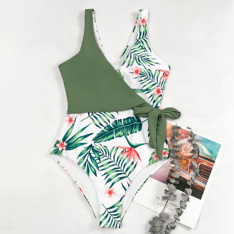 A multicolor patchwork one‑piece swimsuit for women featuring a push‑up design, high‑elastic fabric, and built‑in padding.