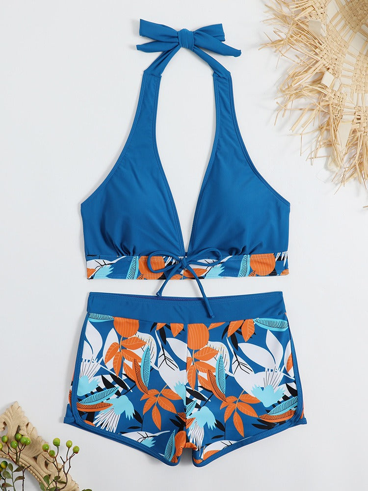 Women’s high‑waisted college‑style sports surfing swimsuit featuring a supportive tie‑back top with light padding and matching high‑waist bottoms designed for movement and comfort.