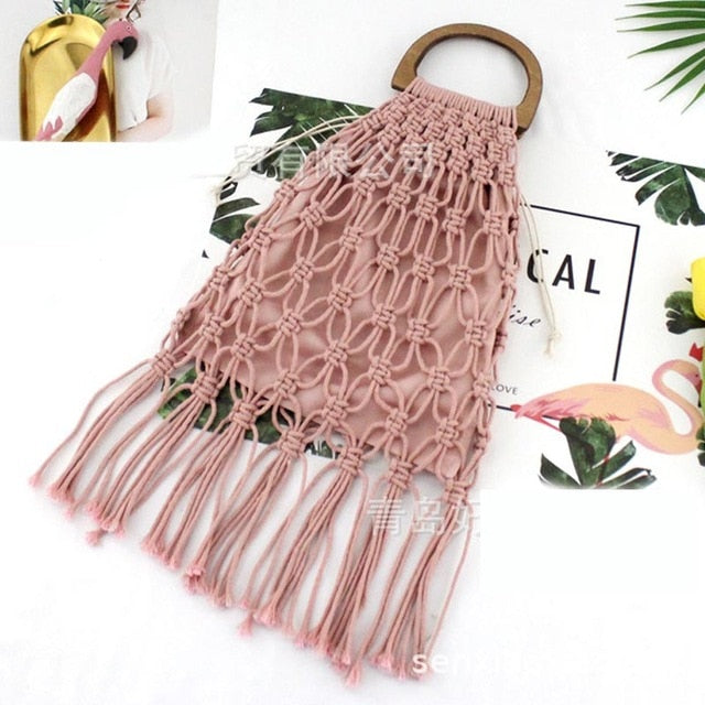 Brown woven handbag with wooden handles.