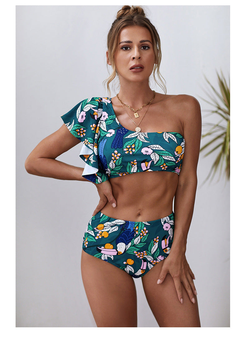 Ruffled one‑shoulder swimsuit in floral summer print.