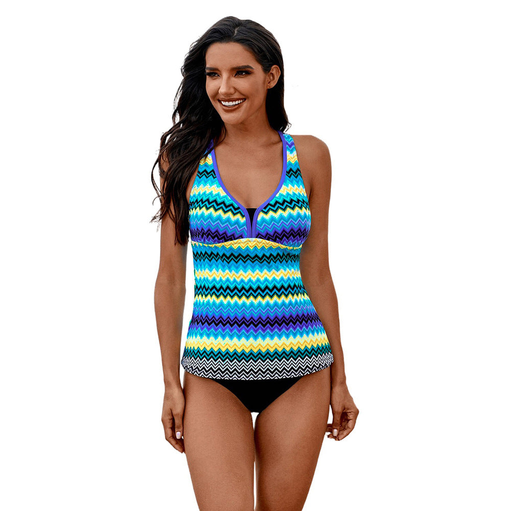 Woman wearing a colorful zigzag patterned swimsuit sold at PeachyBeanz.