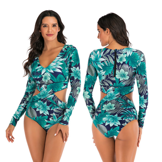 Woman wearing a floral cut-out swimsuit sold at PeachyBeanz.