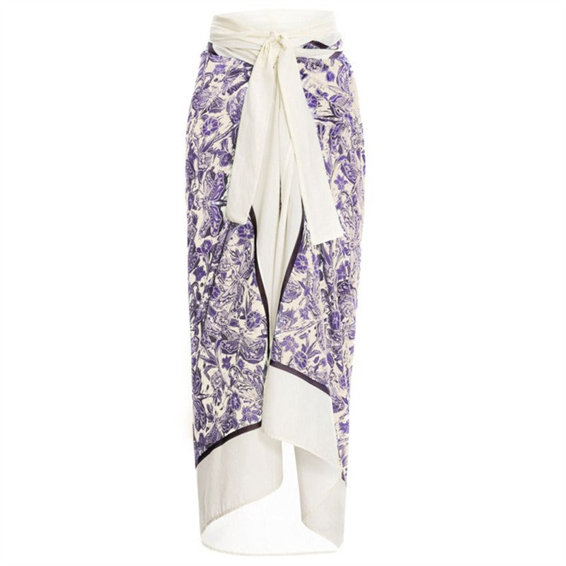 Purple floral skirt with a white belt on a white background
