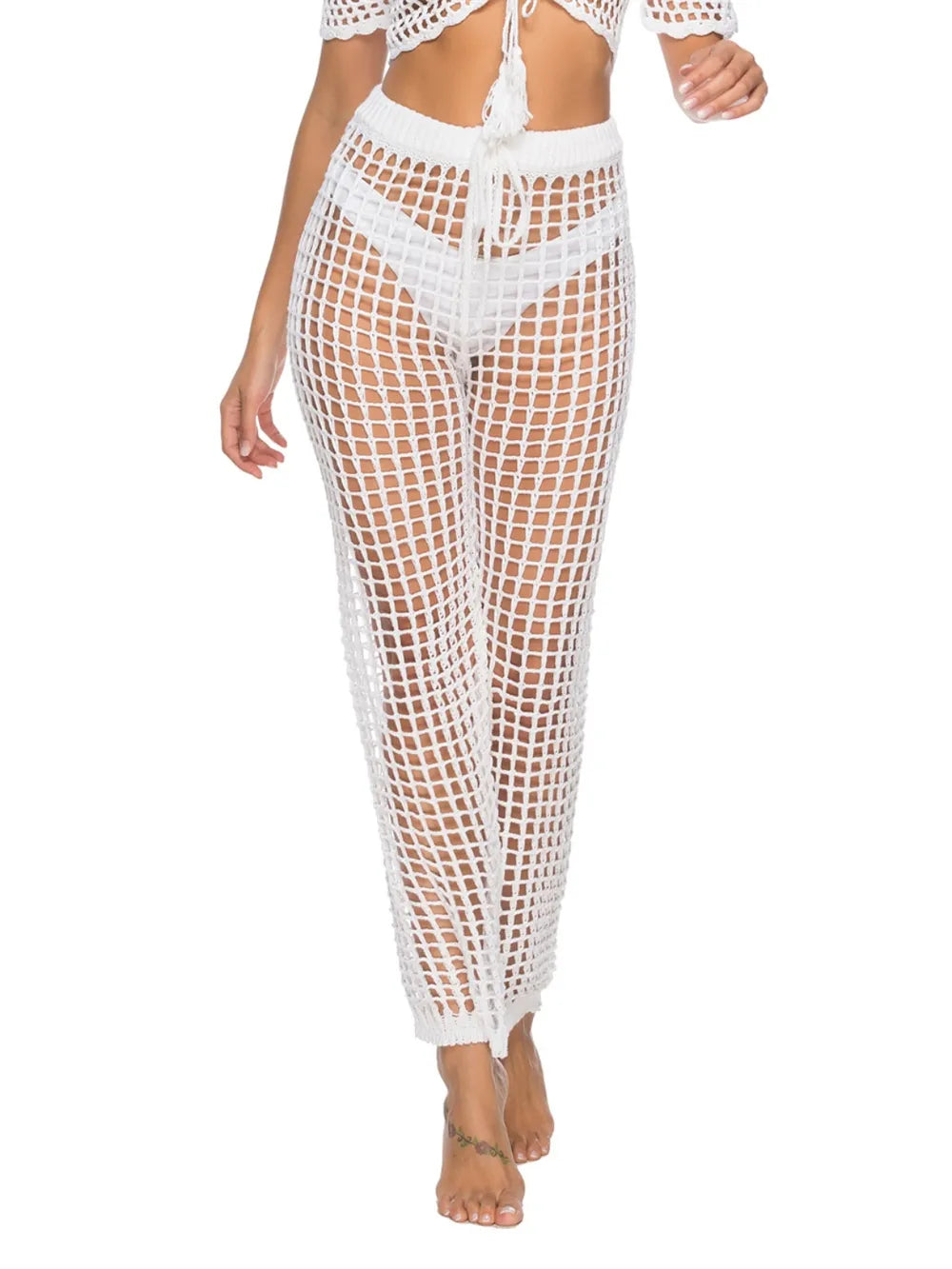 High‑waist cutout swim cover‑up pants with tie‑up closure in a solid color, displayed on a plain background.