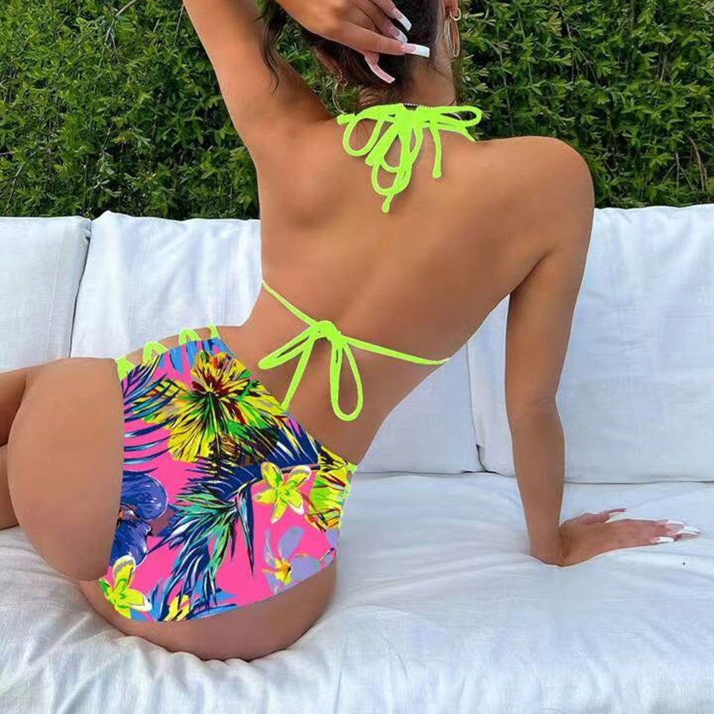 Person wearing a colorful bikini with a floral pattern on a white couch. Sold at PeachyBeanz.