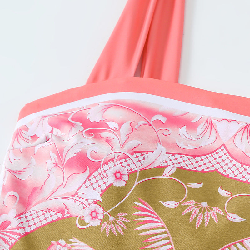 Coral bikini top with floral pattern on a white background