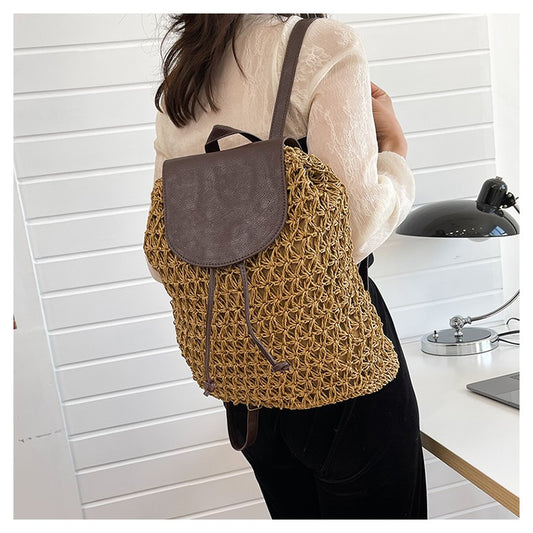 Person wearing a brown woven backpack in a kitchen setting