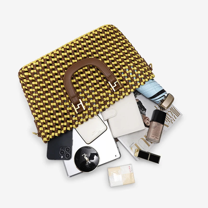 Yellow woven handbag with a brown handle on a white background