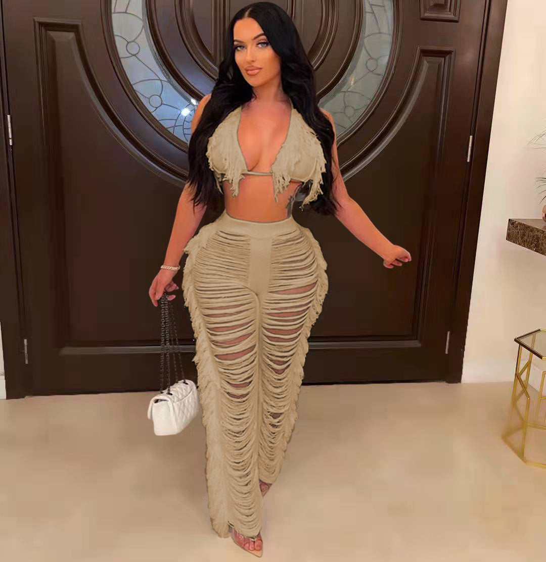 Woman in a stylish outfit with ruched design walking indoors.