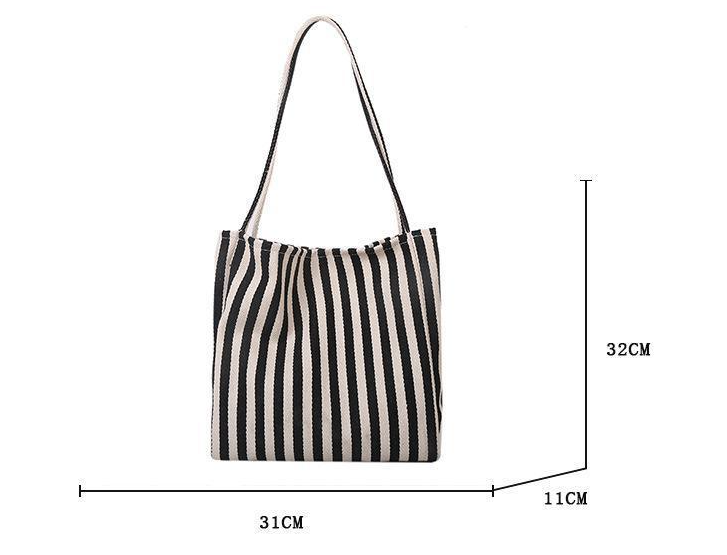 Black and white striped tote bag with measurements on a white background