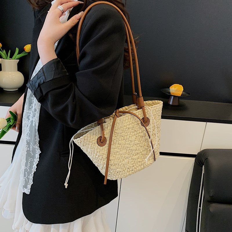 Woven handbag in an office sold at PeachyBeanz