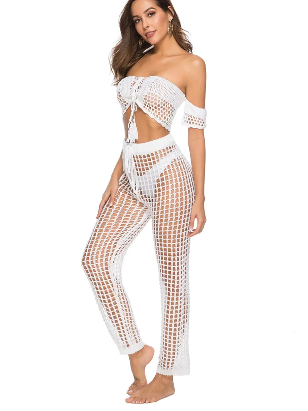 High‑waist cutout swim cover‑up pants with tie‑up closure in a solid color, displayed on a plain background.