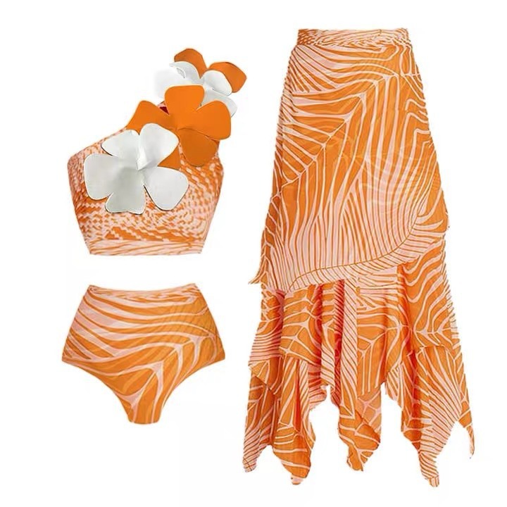 Orange 3D printed flower bikini set with matching skirt coverup.