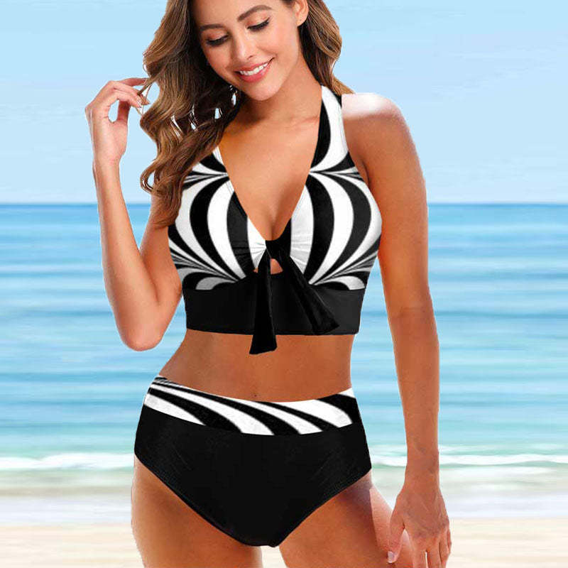 A colorful bow‑tie two‑piece swimsuit featuring a sleeveless design, soft chest padding, and a pattern style sold at PeachyBanz.