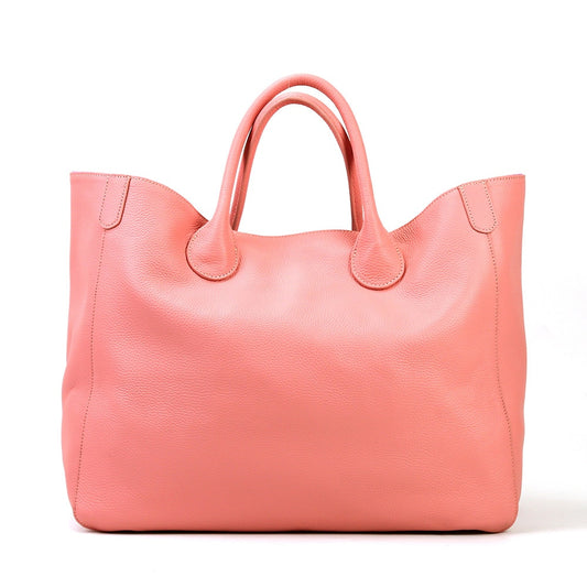 Pink bag with a white background sold at PeachyBeanz.