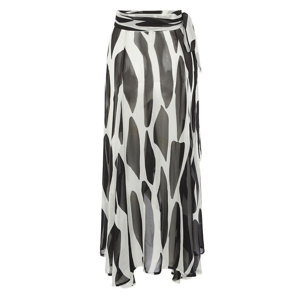 Lightweight black and white swim skirt cover‑up with a two‑tone split pattern laid flat.