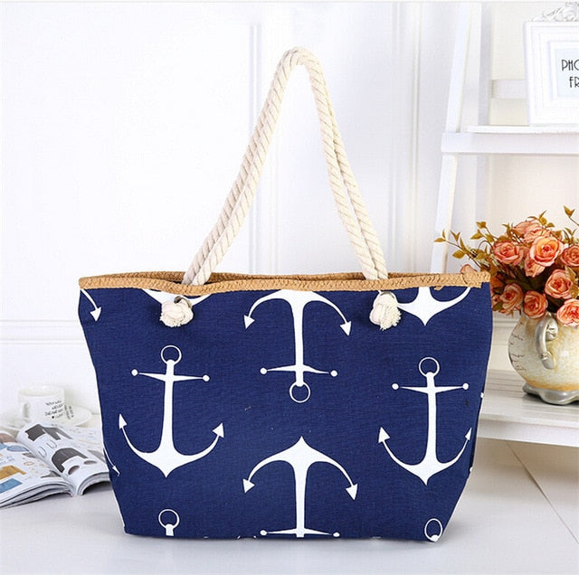 Blue tote bag with white anchor pattern on a white surface sold at PeachyBeanz