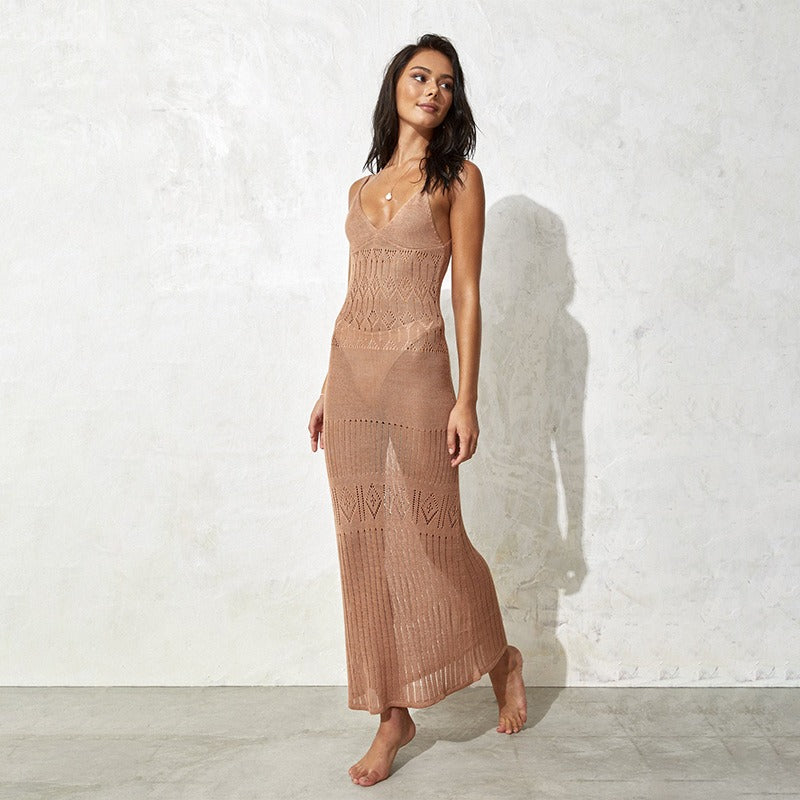 This knitted cover up blends airy texture with a streamlined shape for a modern resort look. 