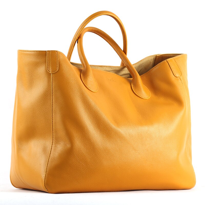 Yellow bag with a white background sold at PeachyBeanz.