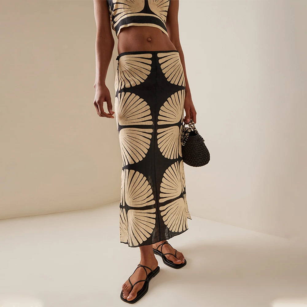 Woman wearing a swimsuit coverup top and skirt sold at PeachyBeanz