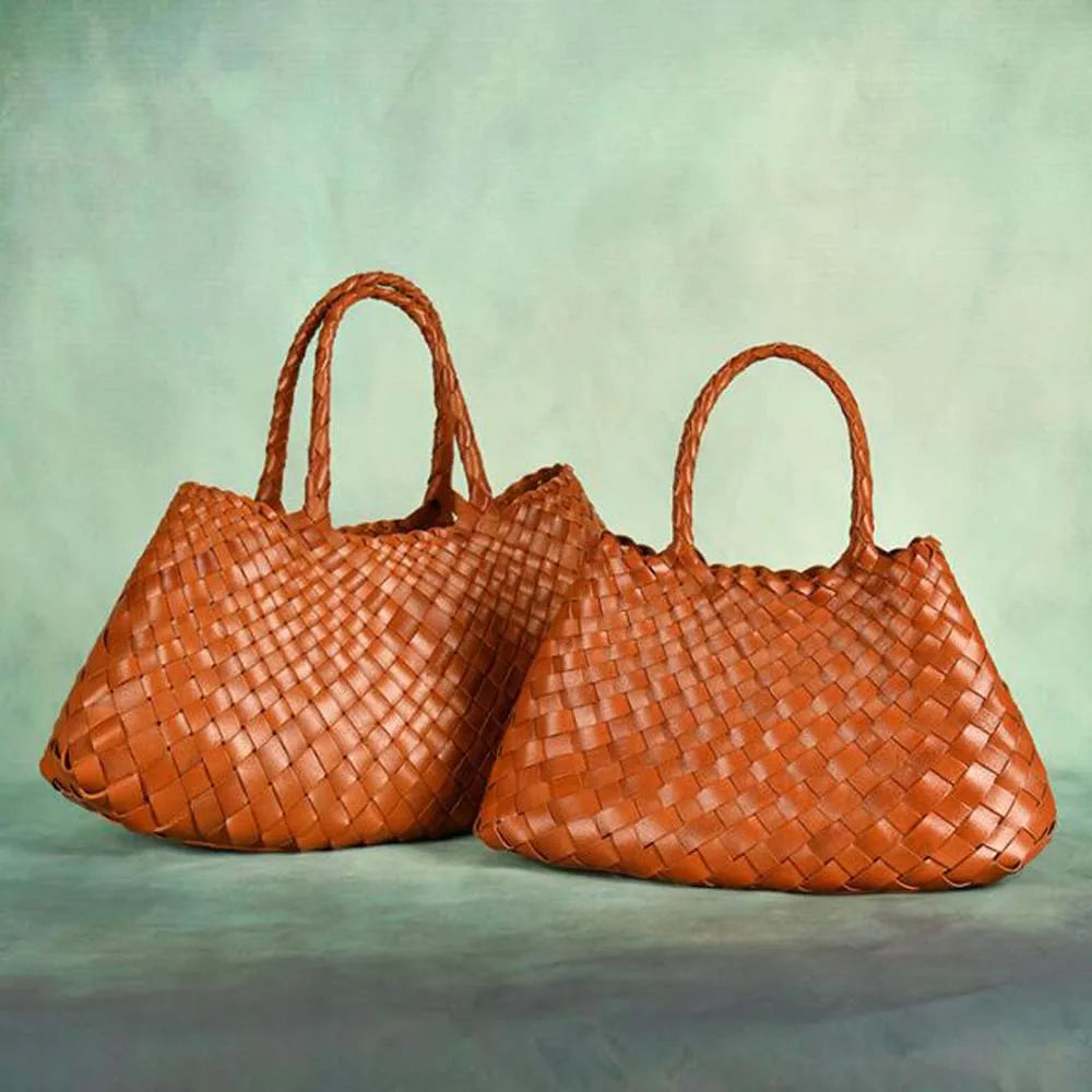 Brown woven handbag on against a plain background
