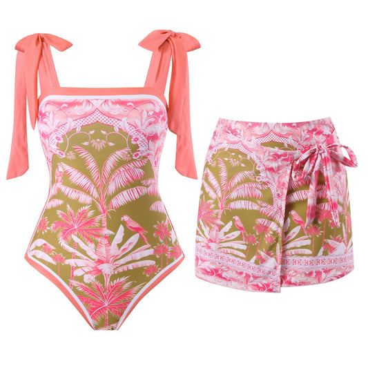 Coral bikini set with floral pattern on a white background. Sold at PeachyBeanz.