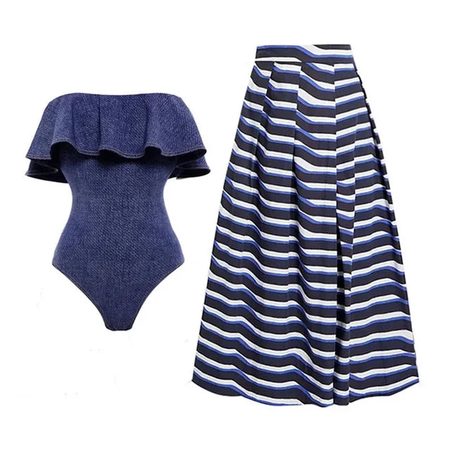 Blue swimsuit and coordinating striped skirt cover-up against a white background.