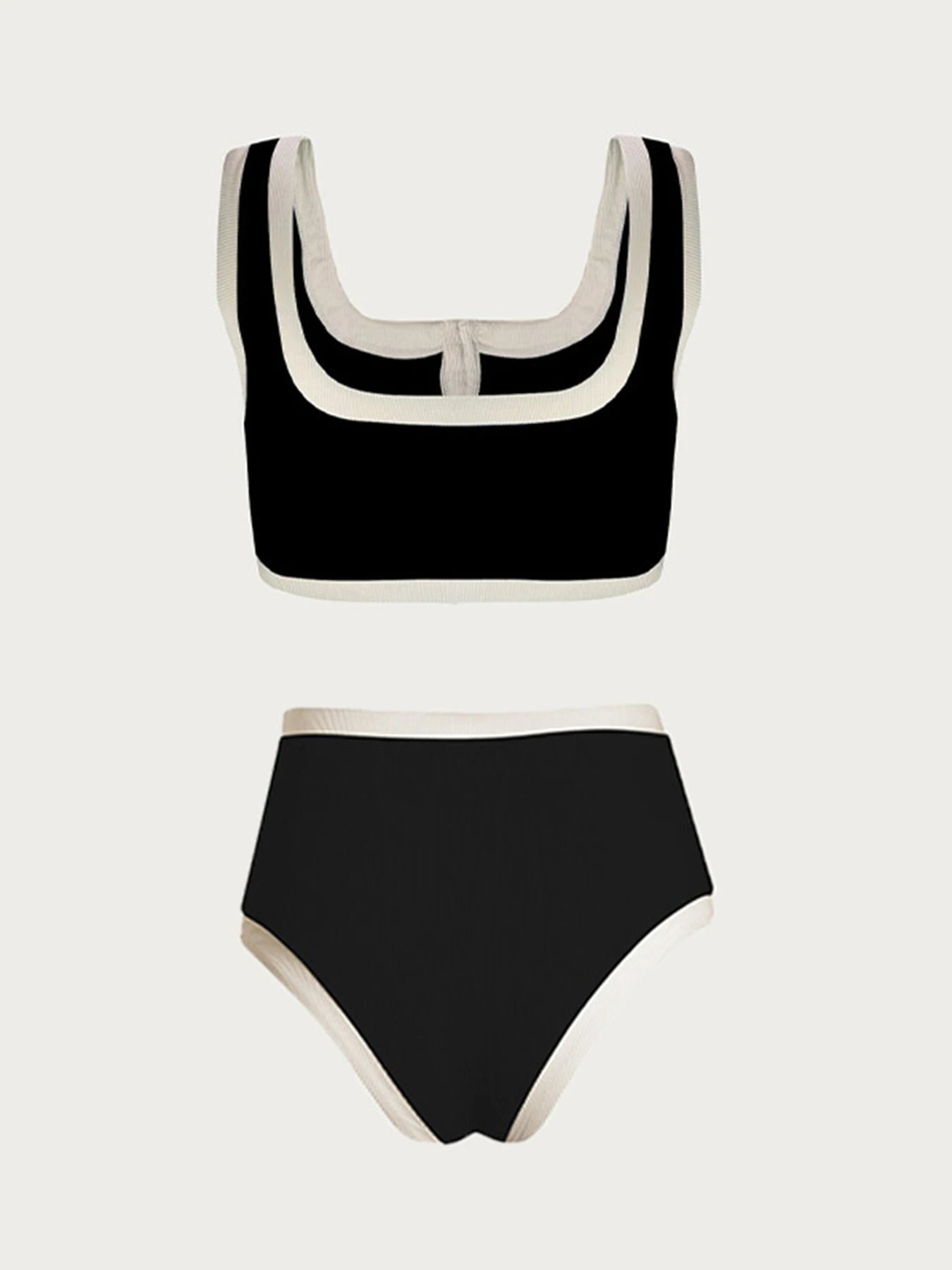 Black and white bikini against a light background