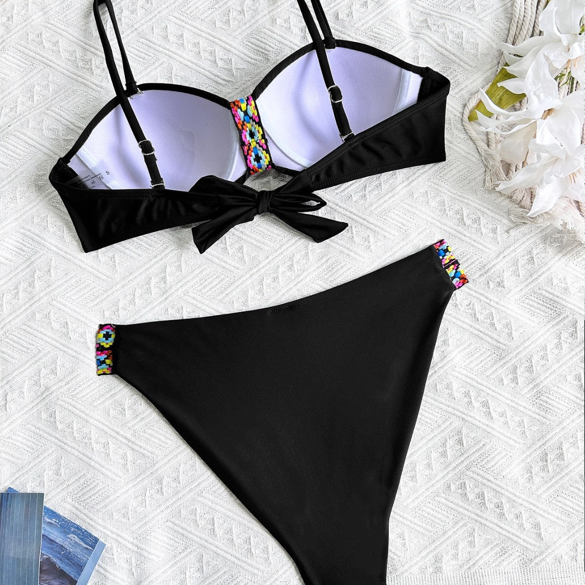 Beautiful Black two-piece bikini with colorful accented stitching to add a flare.