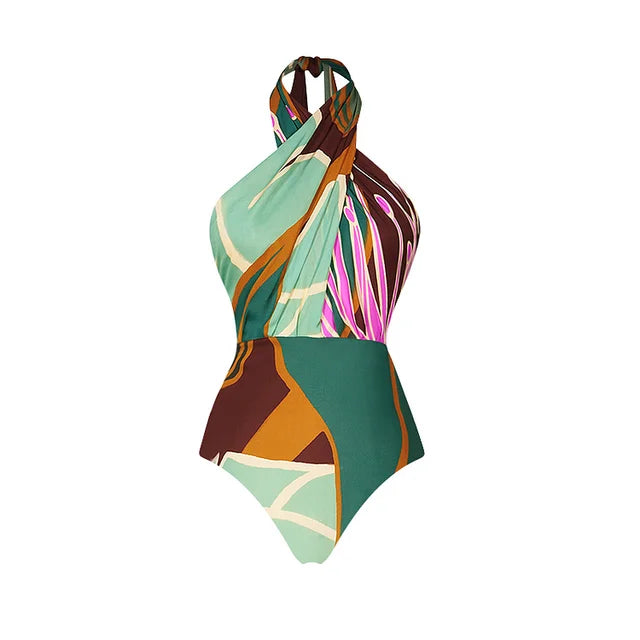 Close‑up of printed swimsuit fabric showing plaid floral pattern, smooth polyester texture, and cross‑neck seam.