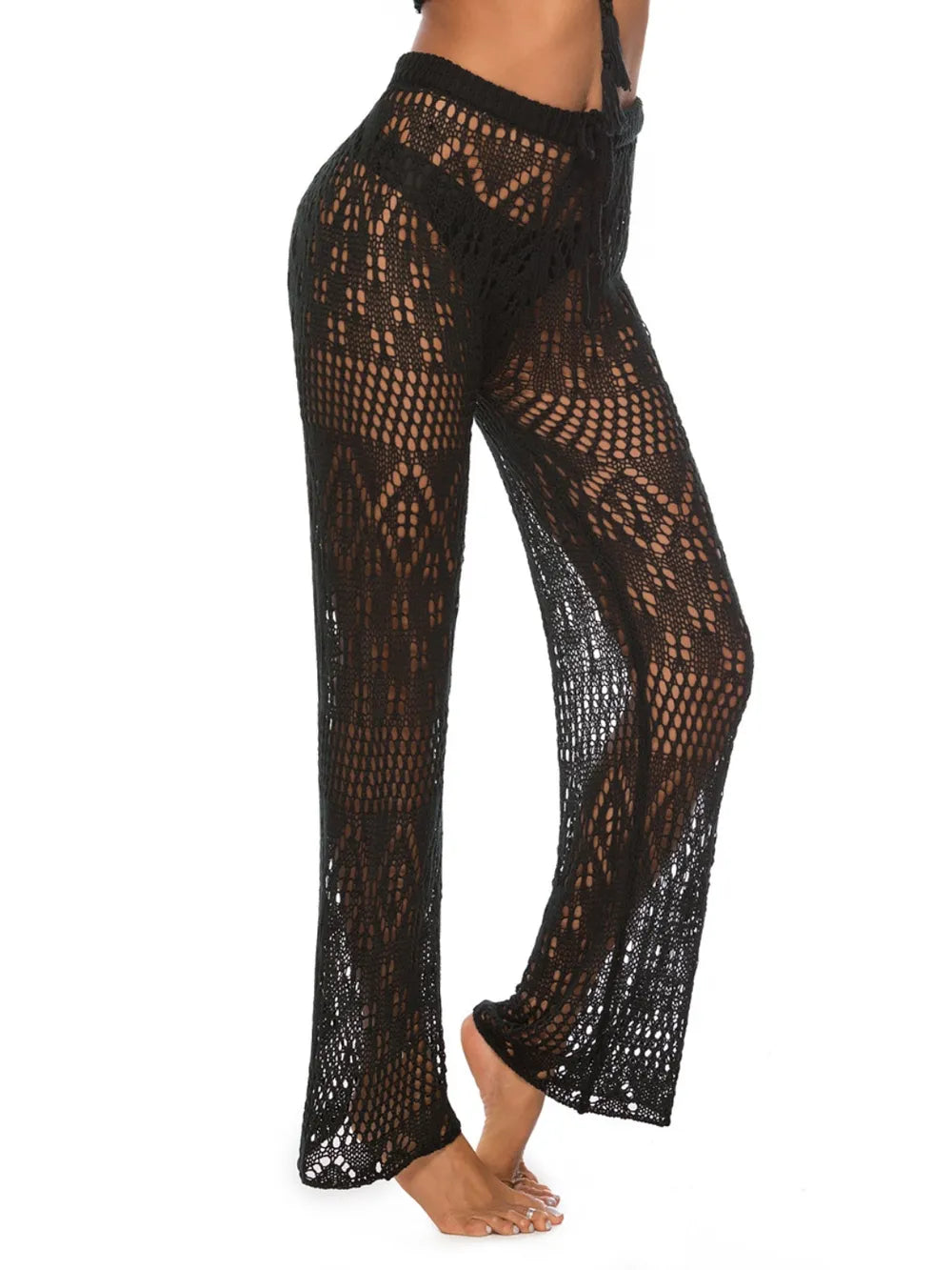 Angled shot highlighting hip cutouts and straight silhouette of swim pants cover up.