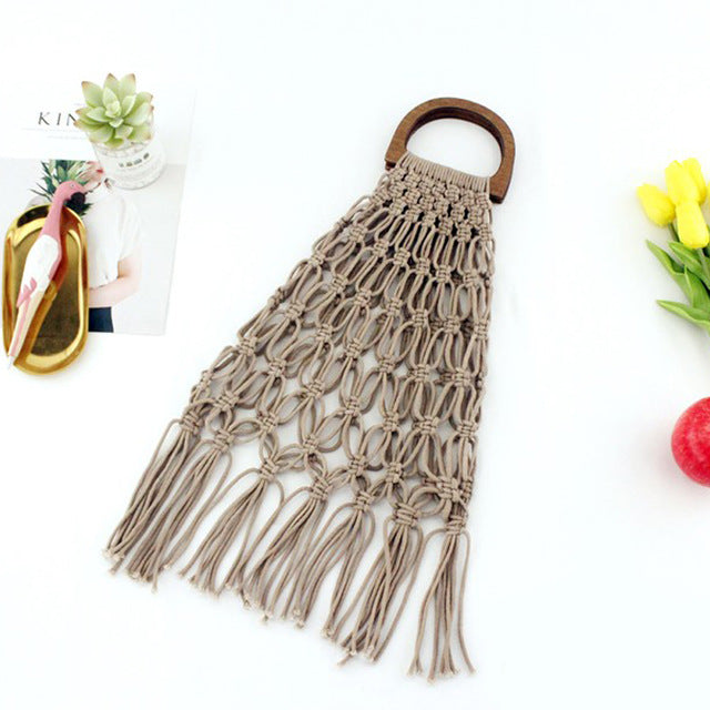 Woven handbag with wooden handles.
