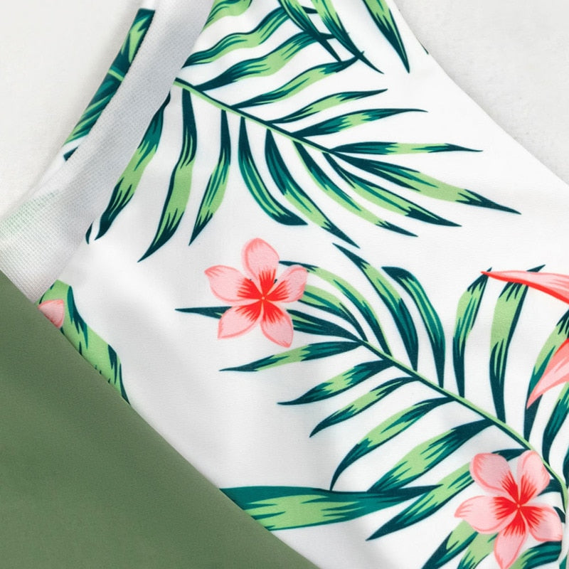 A multicolor patchwork one‑piece swimsuit for women featuring a push‑up design, high‑elastic fabric, and built‑in padding.