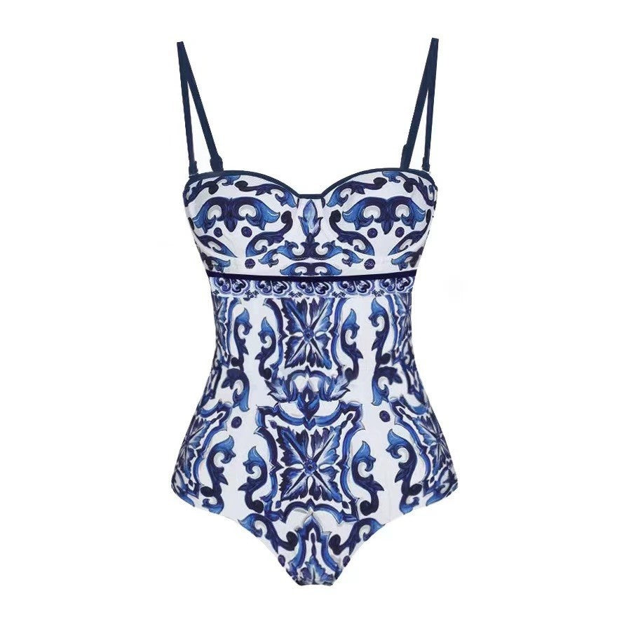 Retro one‑piece swimsuit with blue and white porcelain floral print and scoop neckline.