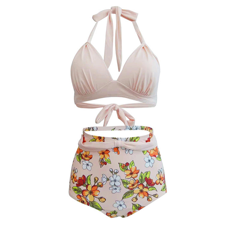 Woman wearing a halter bikini top and high‑waisted floral bottoms.