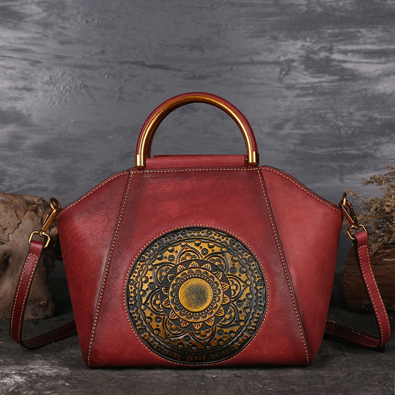 Burgundy genuine cow leather handbag with detachable strap.