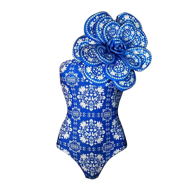 Blue floral one-piece swimsuit against a white background