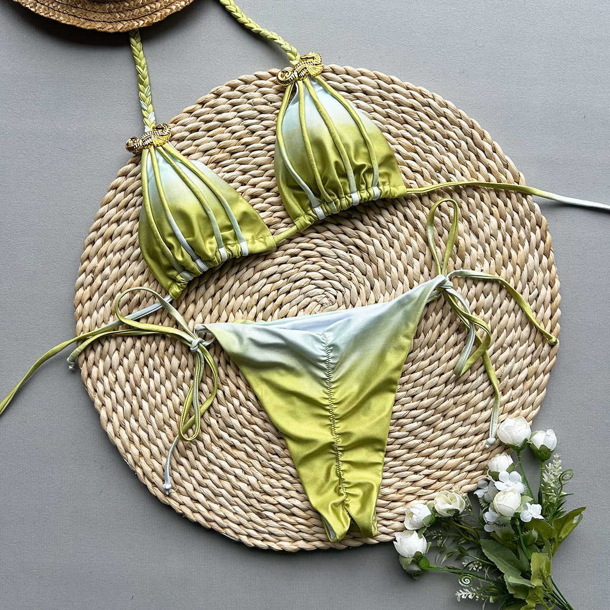 Yellow bikini set with gold accents on a white background