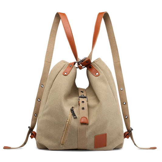 Women’s soft canvas backpack with zipper closure, top handle, and shoulder straps, featuring external pockets and a casual everyday design.