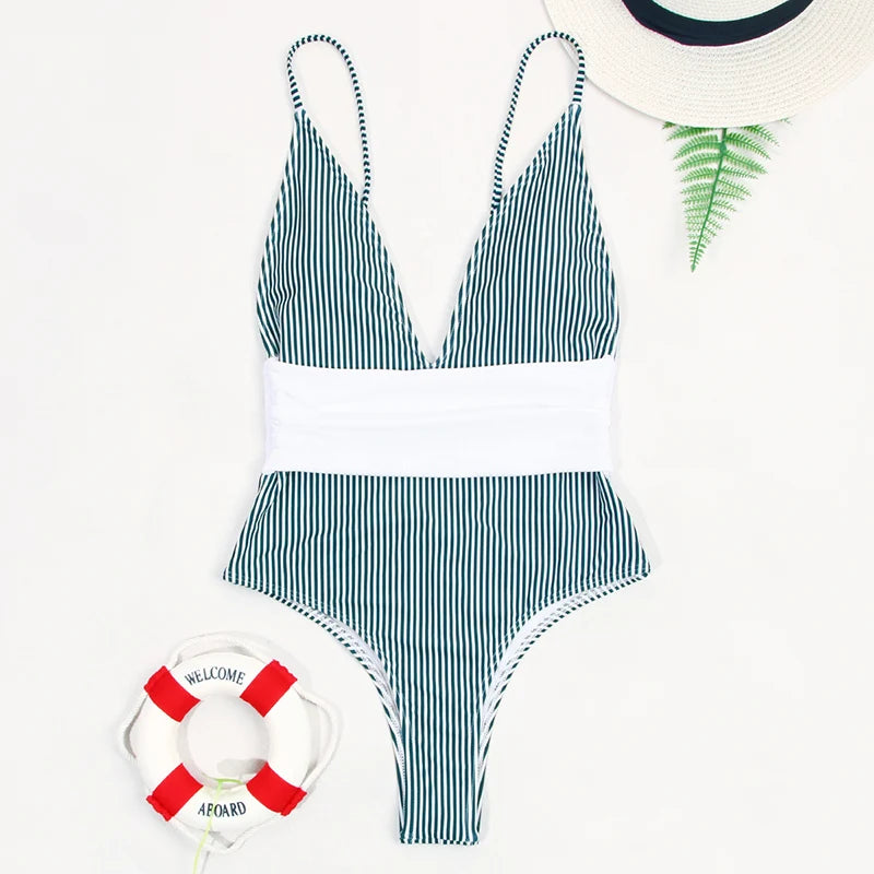 Striped swimsuit with a life buoy and hat on a white background