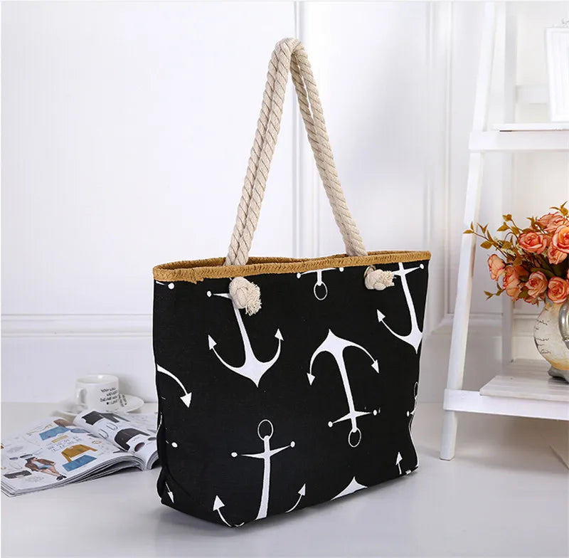 Black tote bag with white anchor pattern on a white surface sold at PeachyBeanz