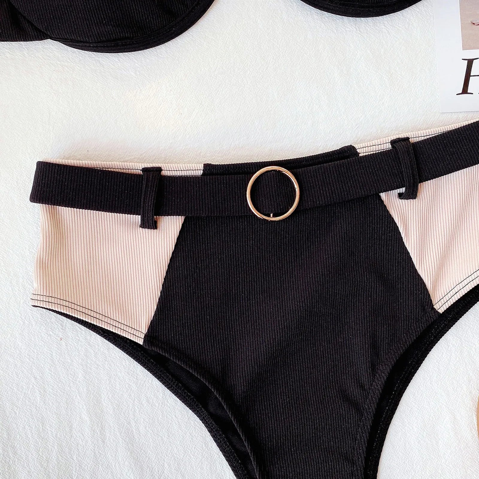 Pink and black bikini set sold at PeachyBeanz.