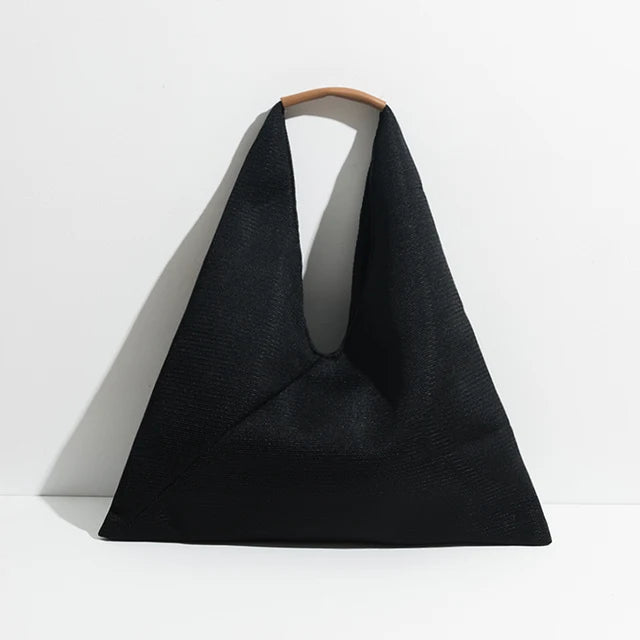 Black triangular bag with handle on a white background
