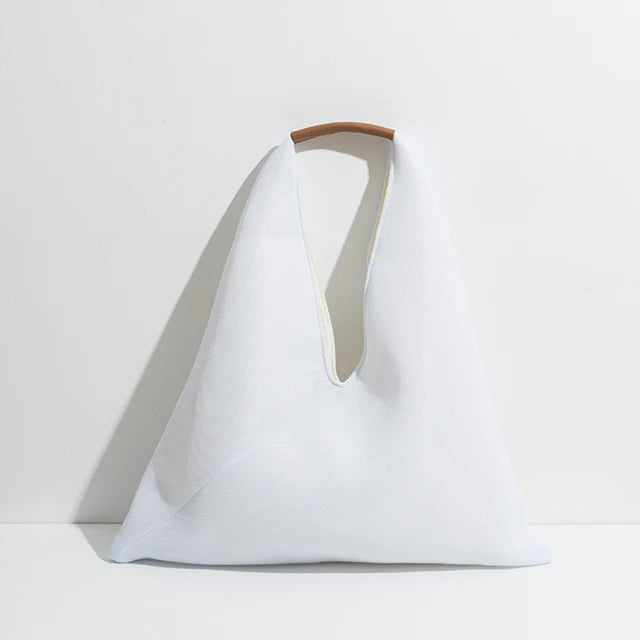 White bag with a handle on a light gray background