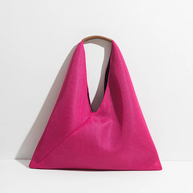 Pink handbag on a light gray background