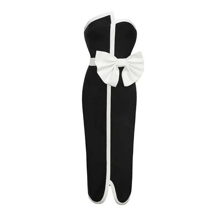 Black strapless top with a large white bow on a white background