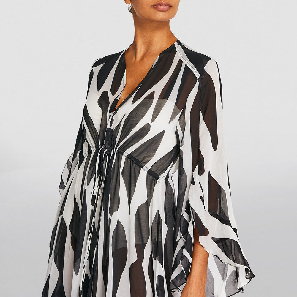 Black and white patterned dress on a plain background